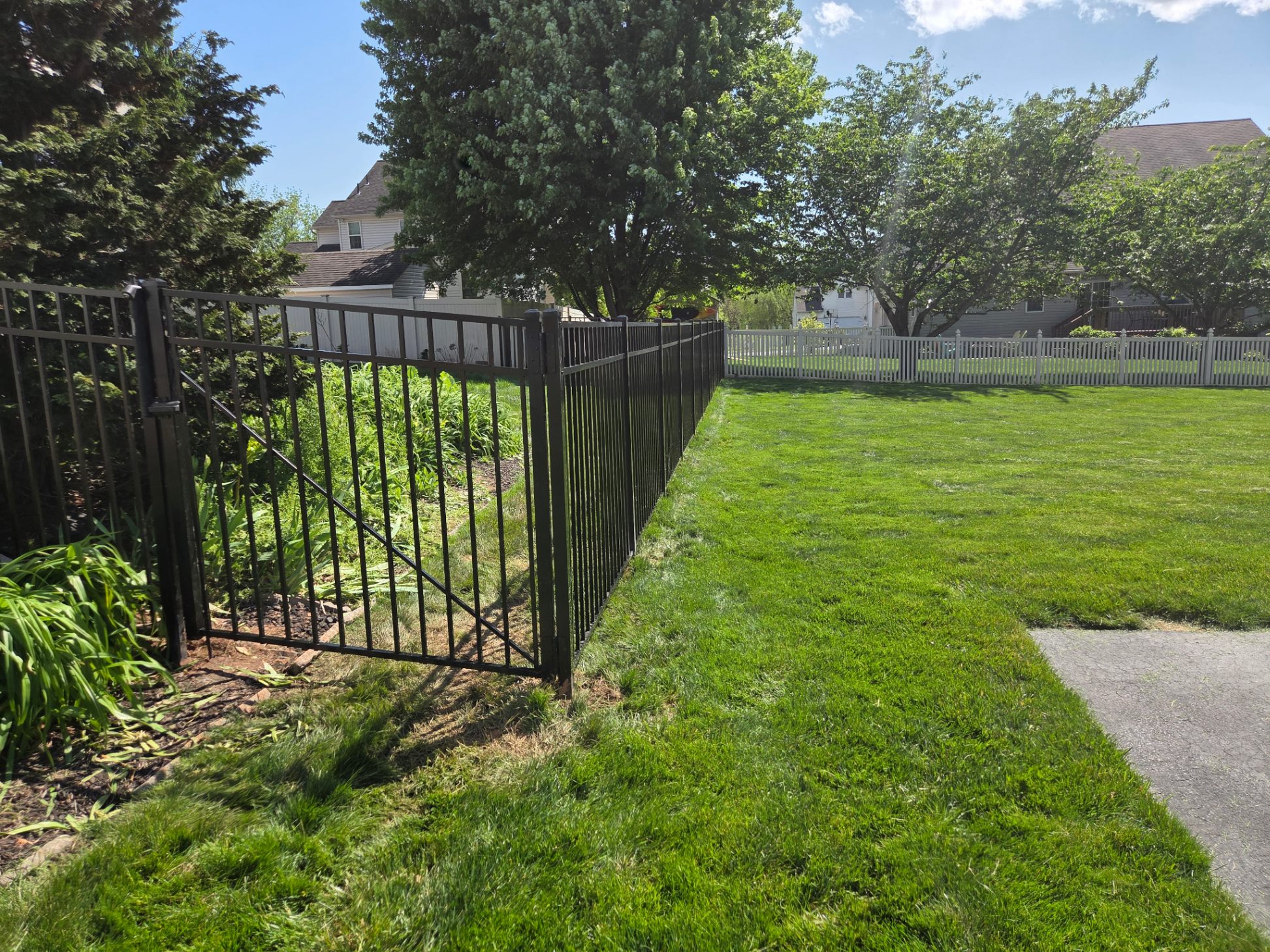 Black aluminum fence with gate — residential yard PA